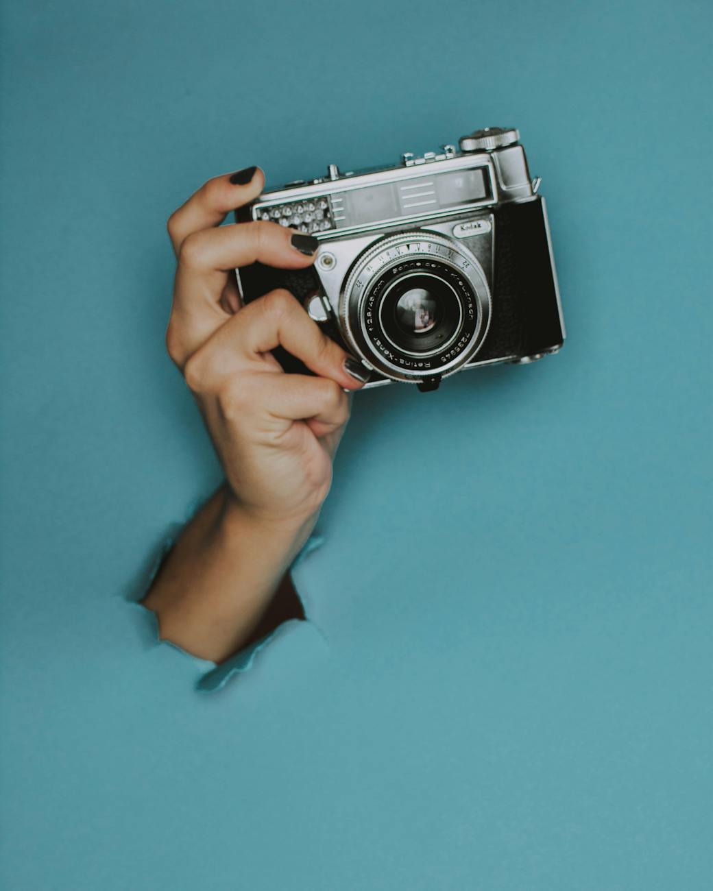 person holding black slr camera